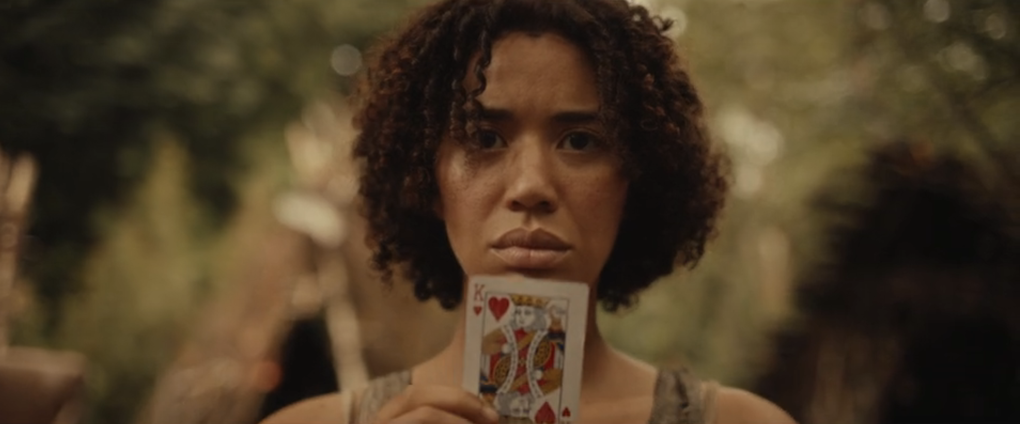 Tai with the King of Hearts card